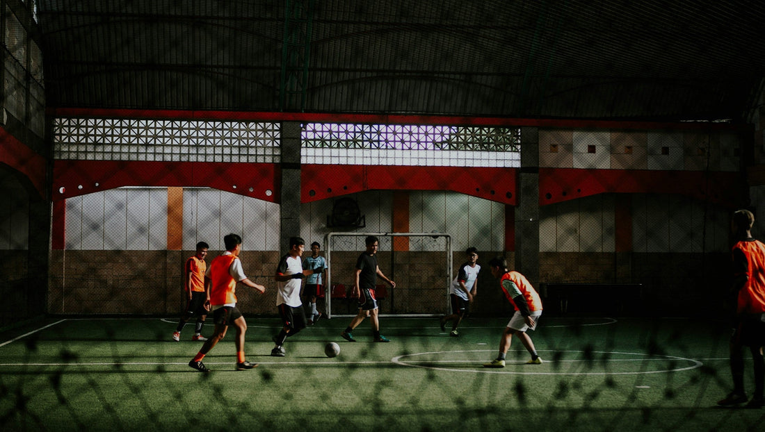 Amateur football players in a high-intensity session; an ideal environment for using football player trackers and IMU-based smart shin guards to analyze playing style.