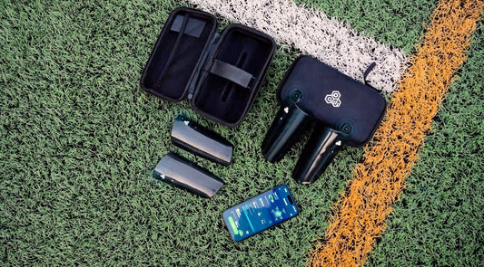 INSAIT JOY Smart Shin Guards and mobile app interface showing a performance report on a football pitch, featuring integrated IMU sensors and high-tech data visualization.